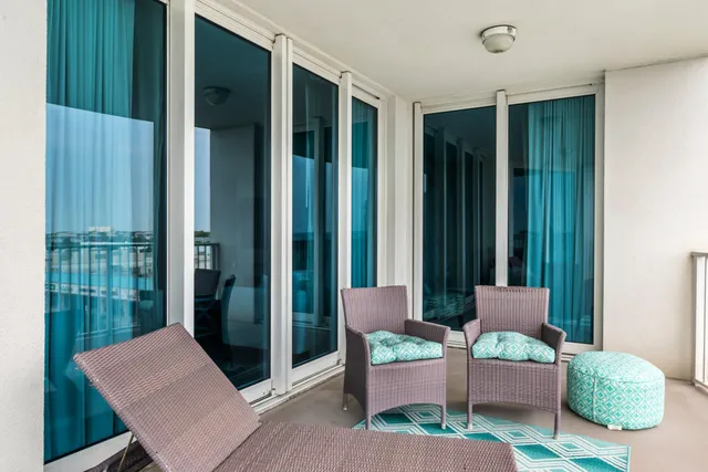 a outdoor living room with furniture and a window