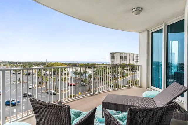 a roof deck with a table and chairs