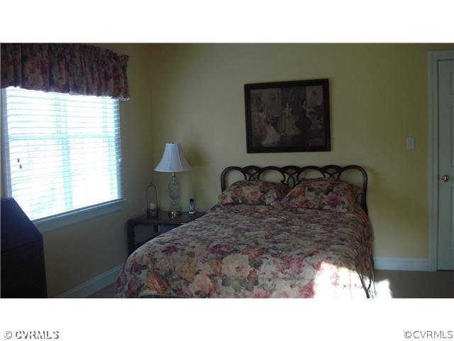 1611 Genito Road Crozier, VA 23039 - Photo 12 of 15 a black and white photo of a bedroom