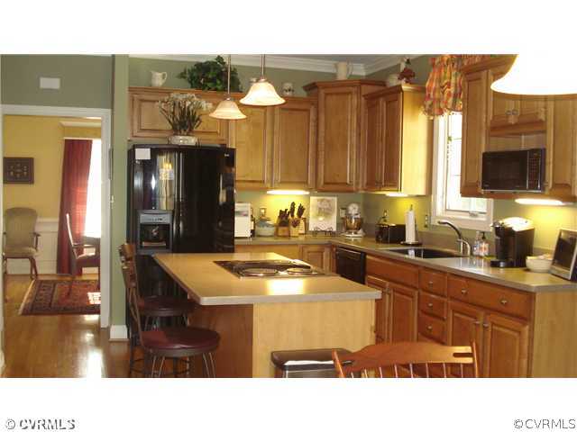 1611 Genito Road Crozier, VA 23039 - Photo 5 of 15 a kitchen with a sink cabinets and window