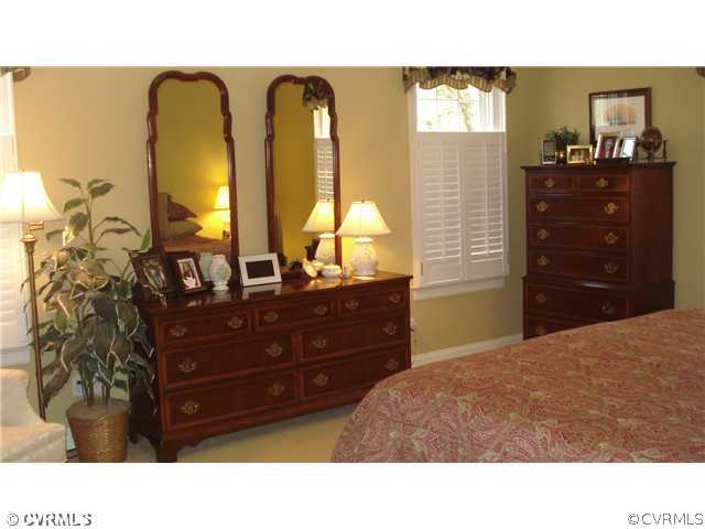 1611 Genito Road Crozier, VA 23039 - Photo 8 of 15 a room with a bed and a dresser