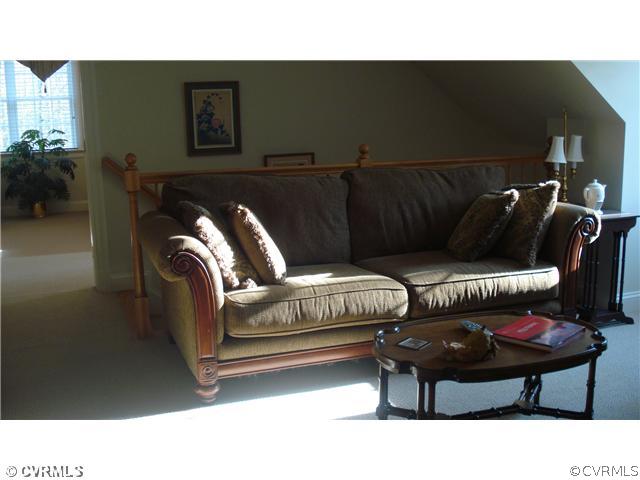 1611 Genito Road Crozier, VA 23039 - Photo 10 of 15 a living room with furniture and a couch