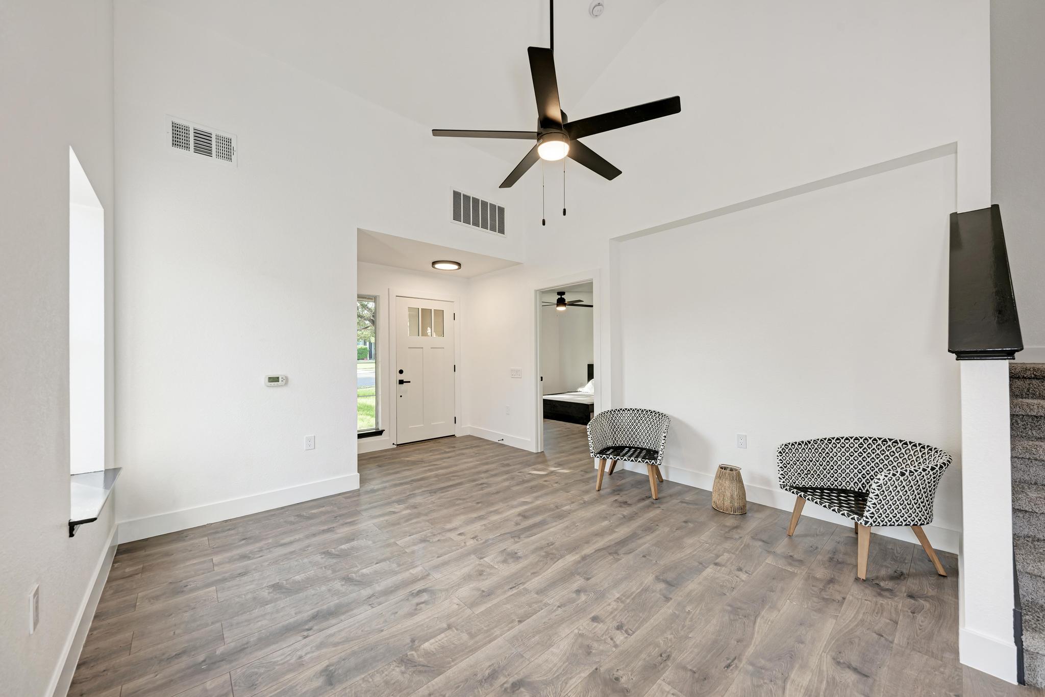 18108 Belfry Pass Manor, TX 78653 - Photo 14 of 40 a view of a workspace with furniture and wooden floor