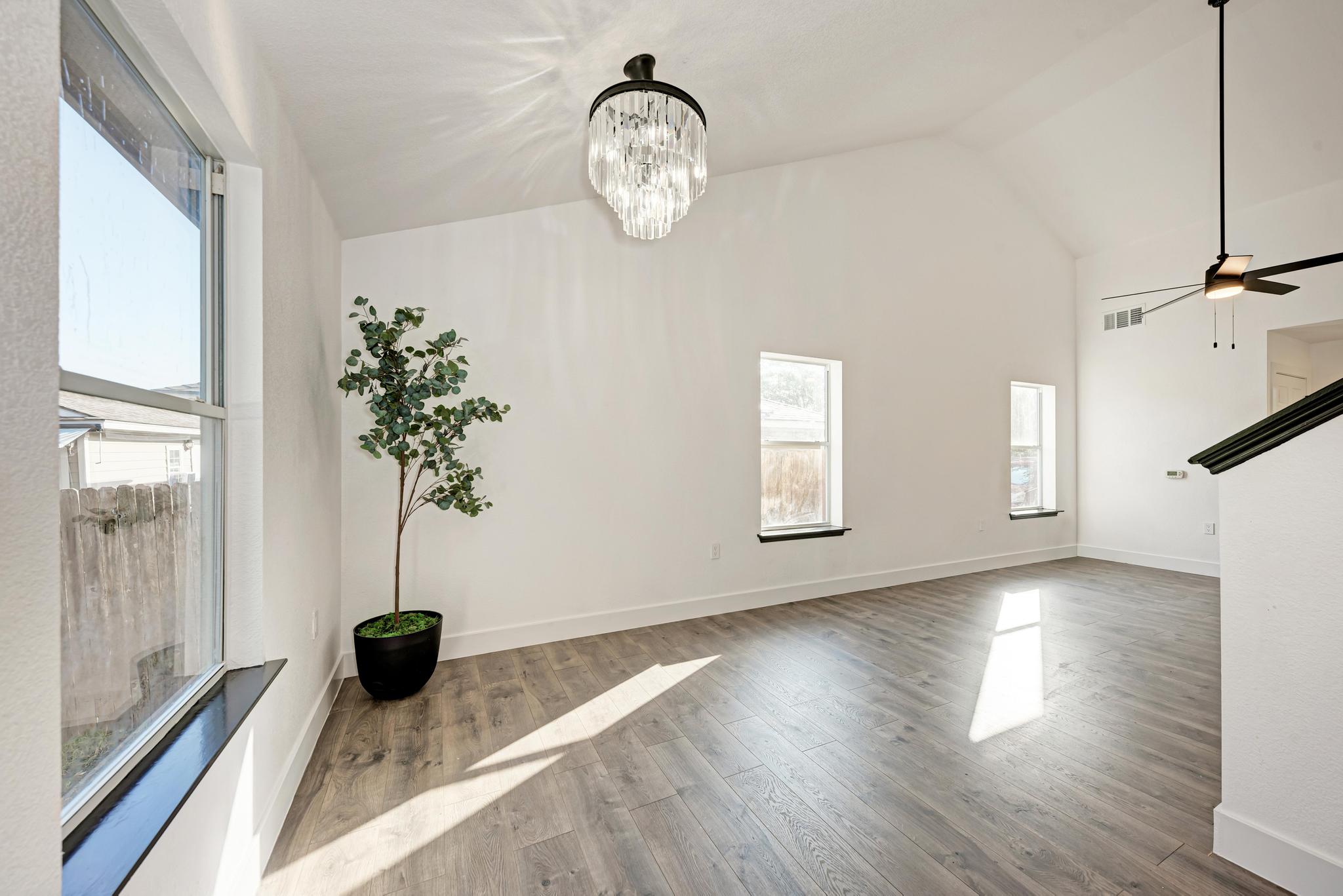 18108 Belfry Pass Manor, TX 78653 - Photo 17 of 40 a view of an empty room with a window and wooden floor