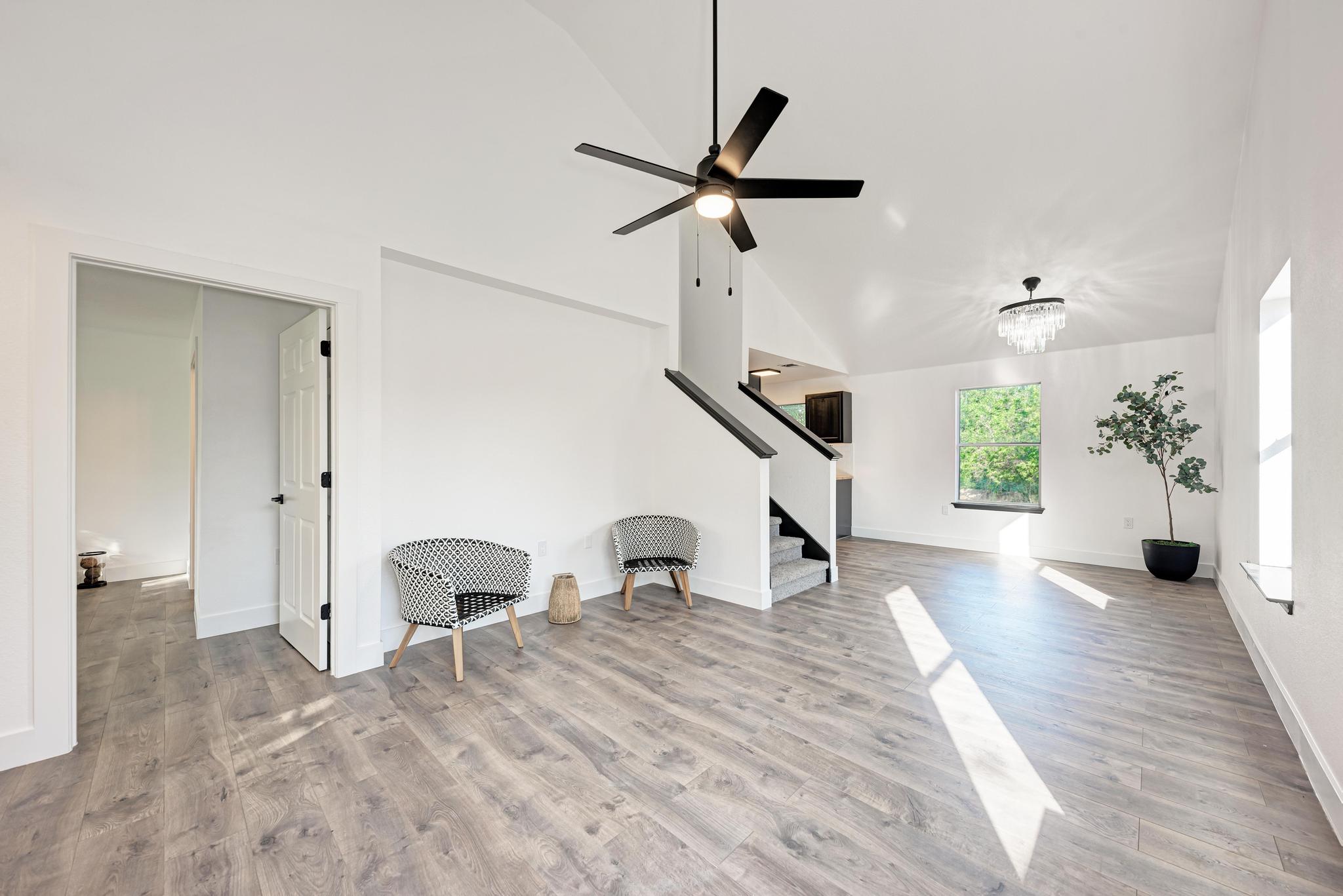 18108 Belfry Pass Manor, TX 78653 - Photo 2 of 40 a view of a livingroom with a window and wooden floor