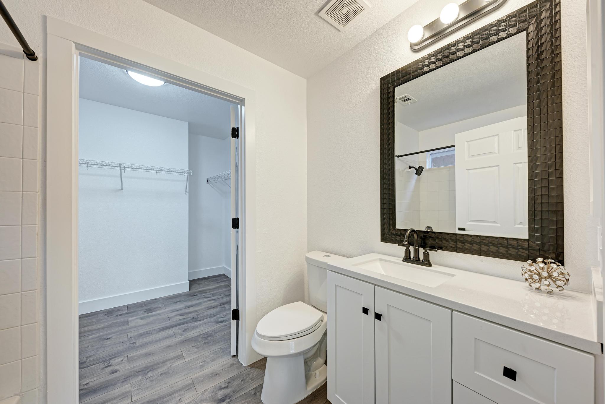 18108 Belfry Pass Manor, TX 78653 - Photo 24 of 40 a bathroom with a sink toilet and shower