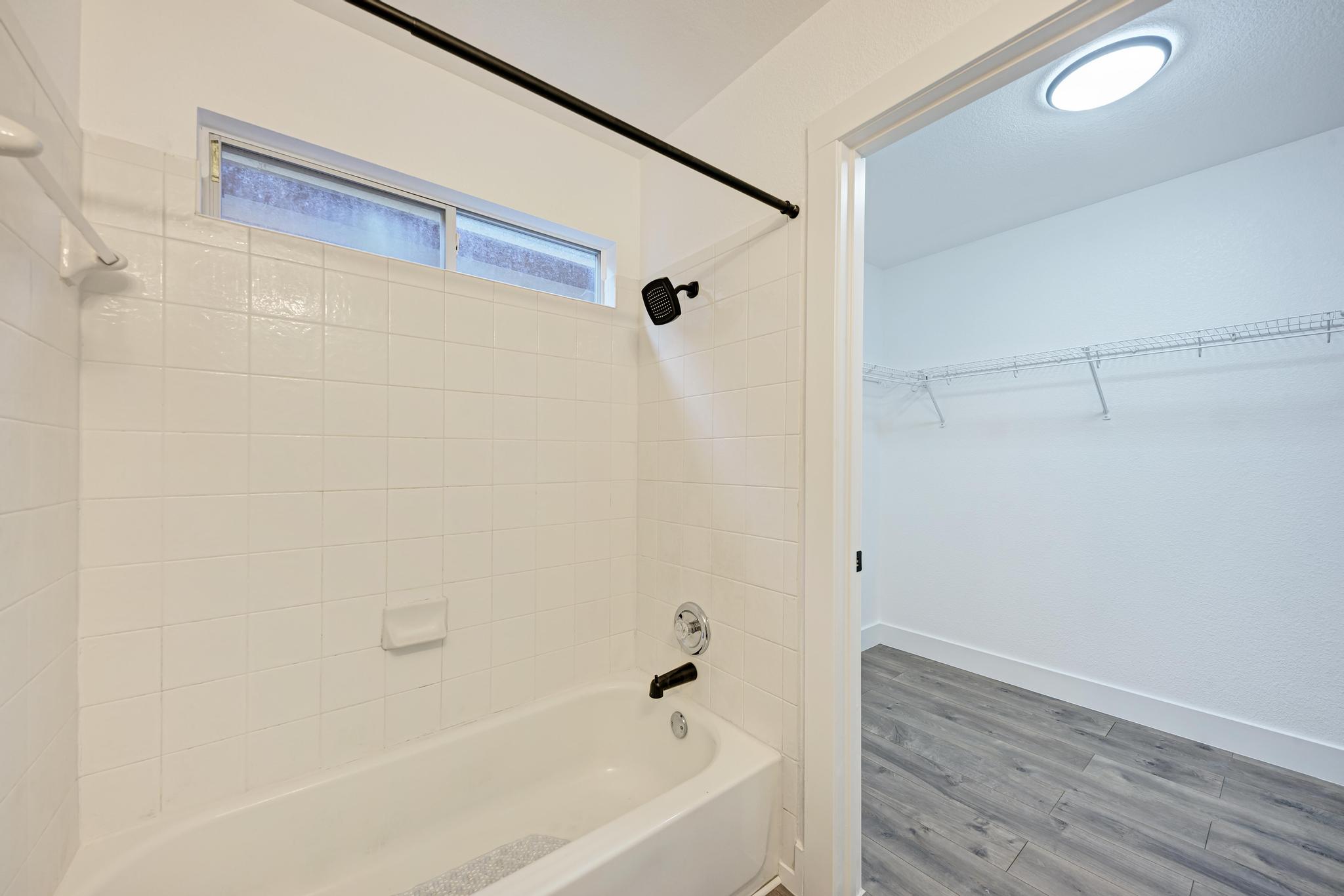 18108 Belfry Pass Manor, TX 78653 - Photo 25 of 40 a bathroom with a bathtub