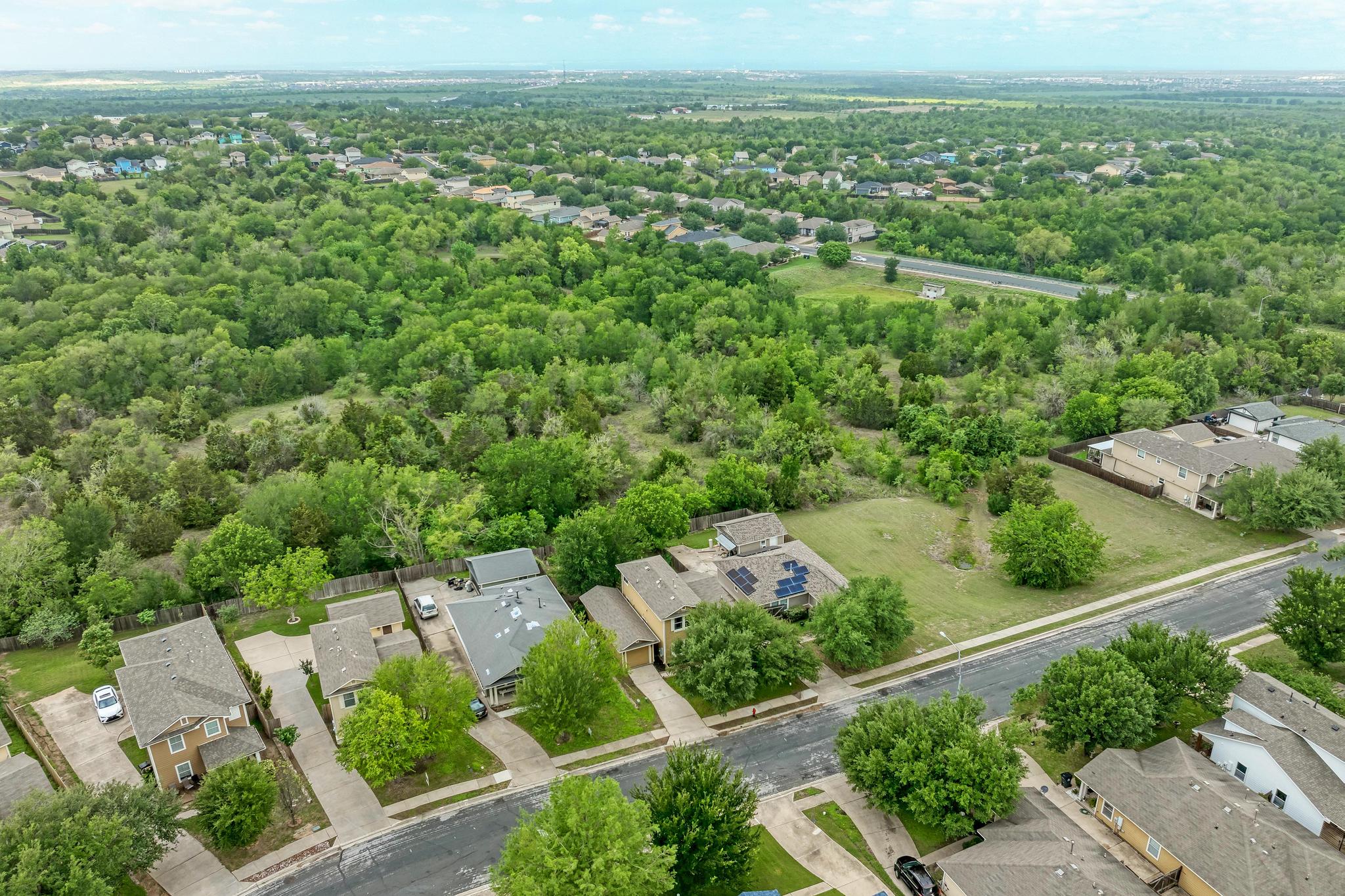 18108 Belfry Pass Manor, TX 78653 - Photo 37 of 40 an aerial view of a city with lots of residential buildings