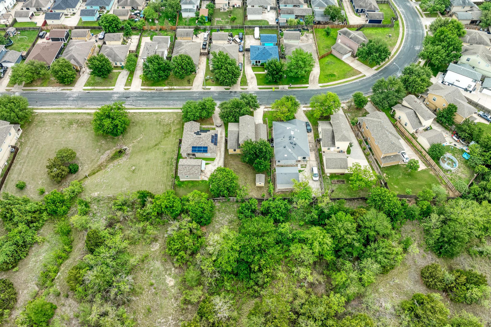 18108 Belfry Pass Manor, TX 78653 - Photo 40 of 40 an aerial view of residential house with outdoor space and trees all around