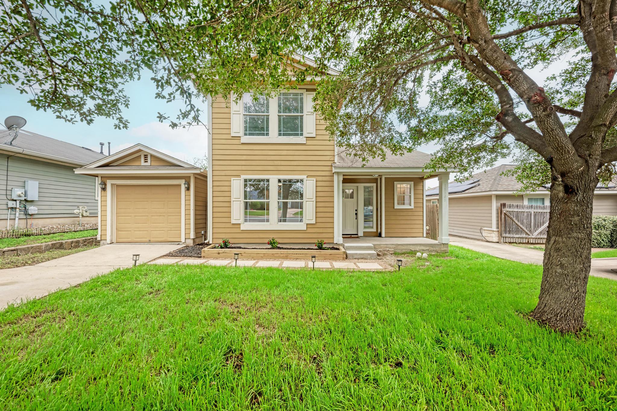 18108 Belfry Pass Manor, TX 78653 - Photo 9 of 40 front view of a house with a yard