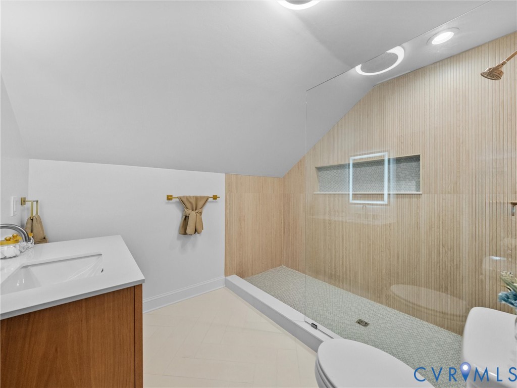 12710 Ivey Mill Road Chesterfield, VA 23838 - Photo 41 of 57 Wood-finish vanity with an integrated sink and whi