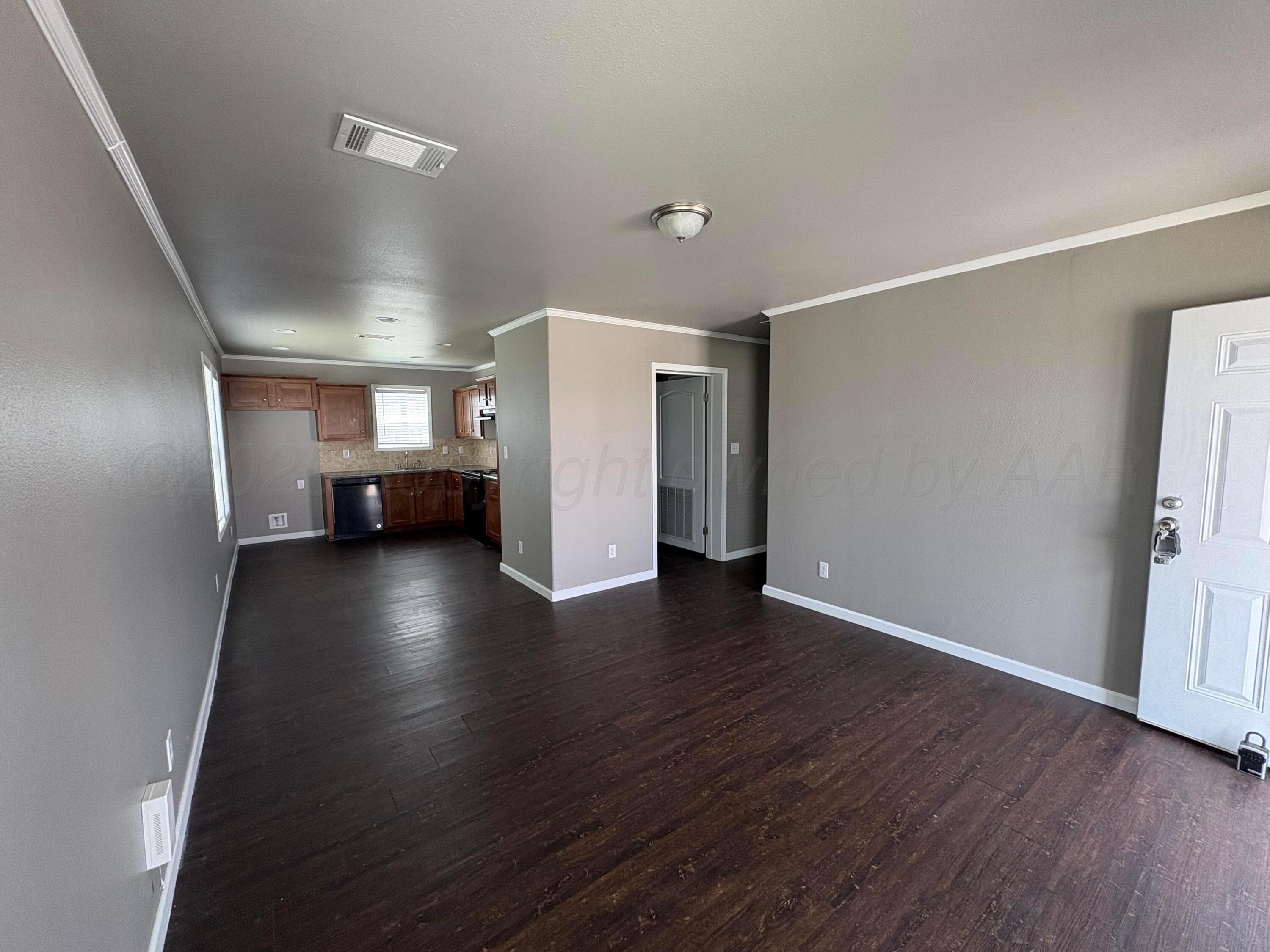 3501 Southeast 21st Avenue Amarillo, TX 79103 - Photo 3 of 11 a view of livingroom with furniture and wooden floor