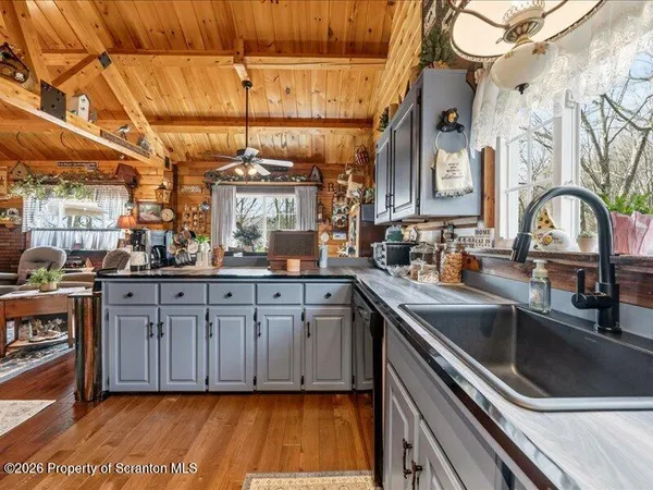 a kitchen with a sink and cabinets