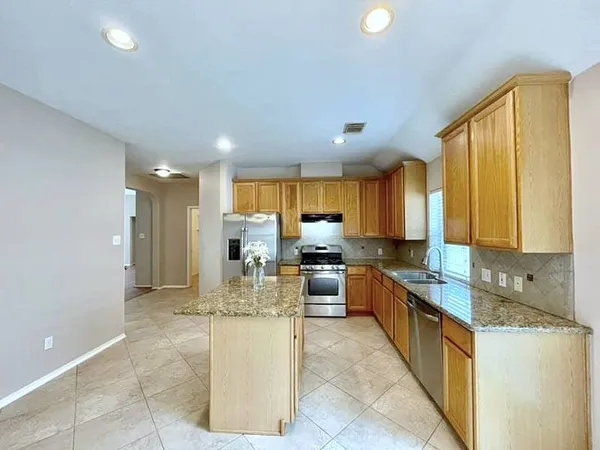 a kitchen with a sink and counter top space