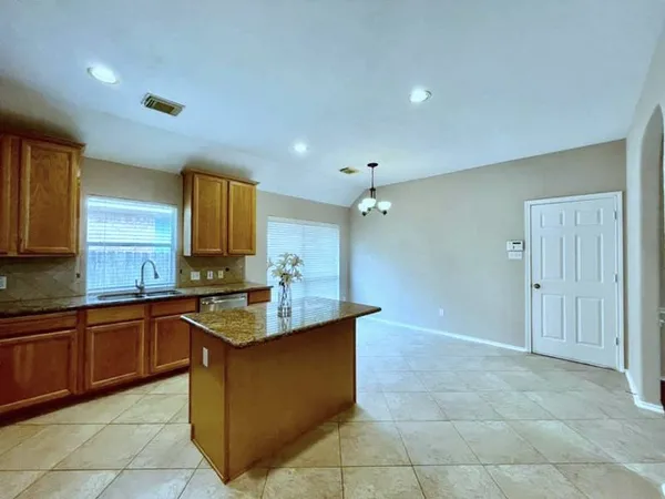 a kitchen with a sink a counter top space and appliances