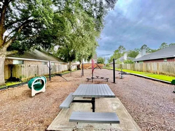 swimming pool view with a backyard space