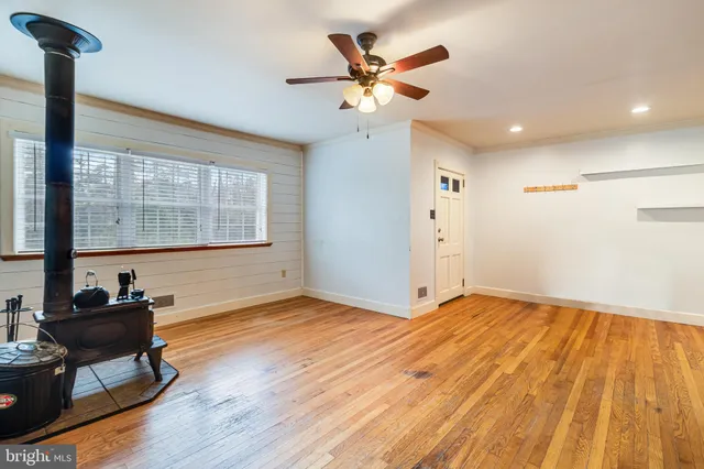 a view of an empty room and a window