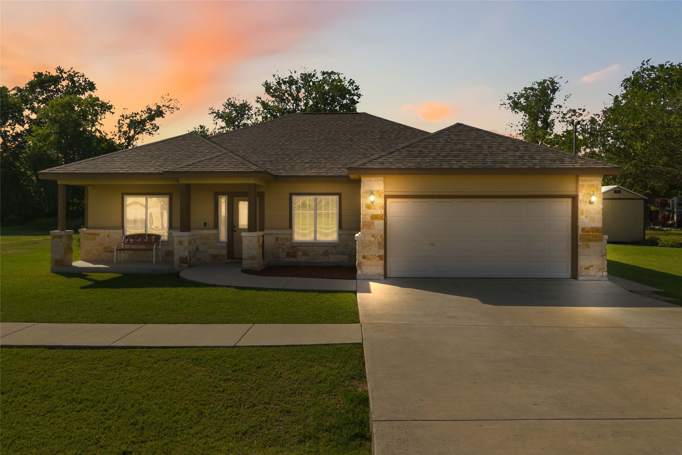 285 Hummingbird Way Martindale, TX 78655 - Photo 35 of 40 a front view of a house with a garden and yard