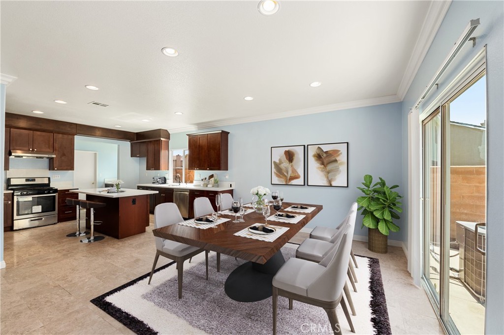 6469 Cattleman Drive Eastvale, CA 92880 - Photo 15 of 35 a view of a dining room with furniture