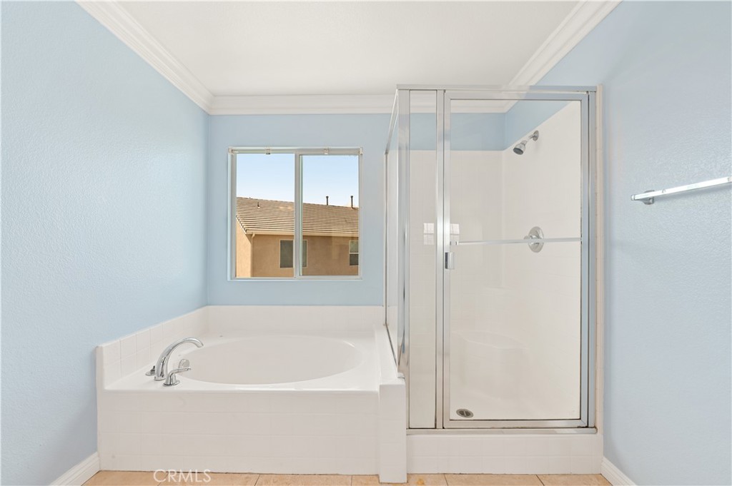 6469 Cattleman Drive Eastvale, CA 92880 - Photo 20 of 35 a white bath tub sitting next to a shower