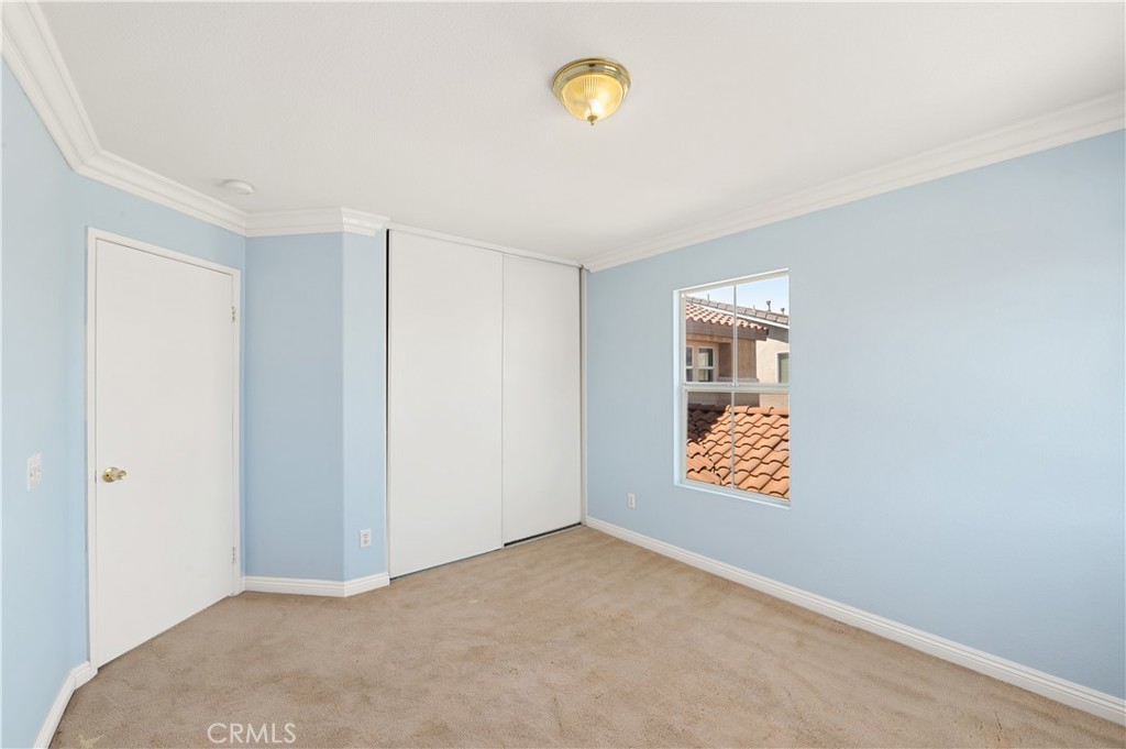6469 Cattleman Drive Eastvale, CA 92880 - Photo 22 of 35 a view of an empty room with a window