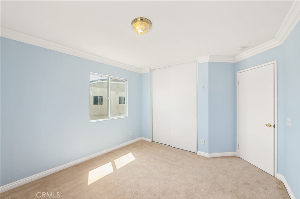 6469 Cattleman Drive Eastvale, CA 92880 - Photo 23 of 35 a view of a room that has a window in it
