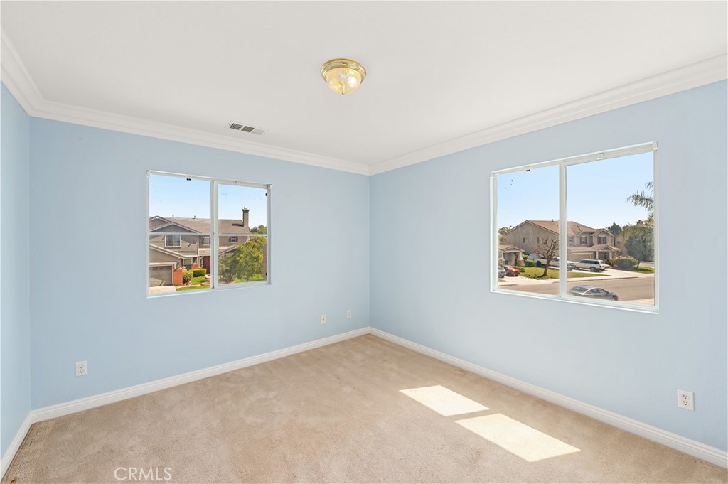 6469 Cattleman Drive Eastvale, CA 92880 - Photo 27 of 35 a view of an empty room with a window