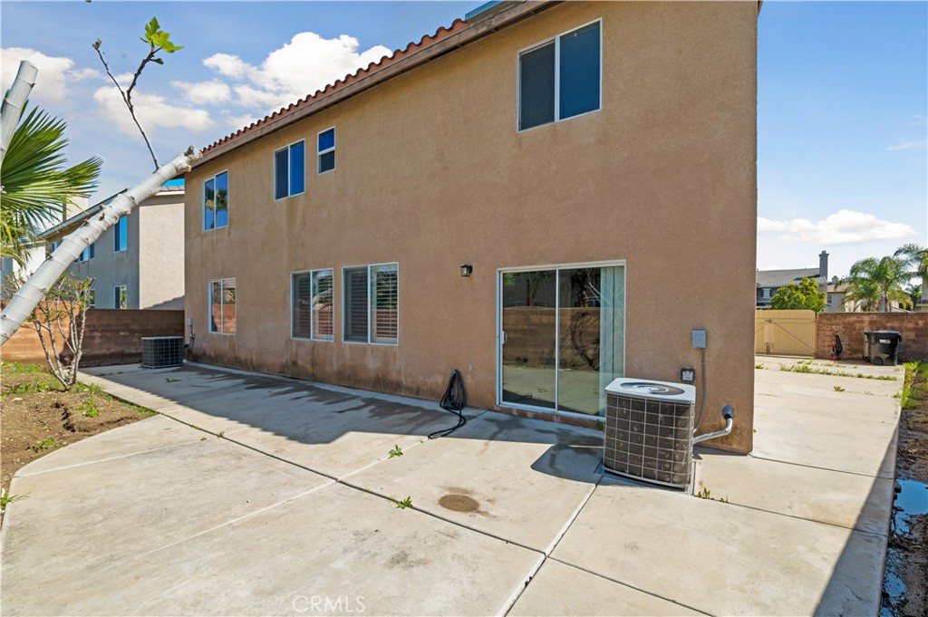 6469 Cattleman Drive Eastvale, CA 92880 - Photo 34 of 35 a front view of a house with a yard