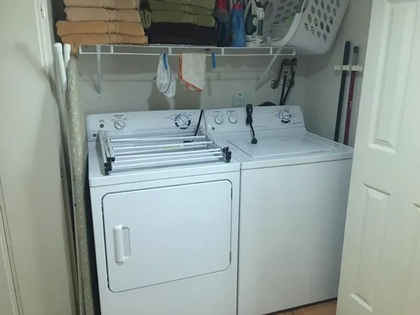 a utility room with dryer and washer