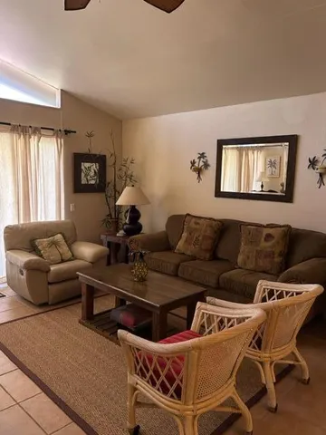 a living room with furniture and a window