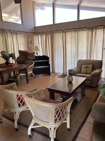 a work room with furniture and window