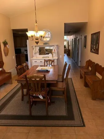 a dining room with furniture and wooden floor