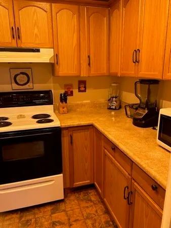 a kitchen with a stove and a microwave