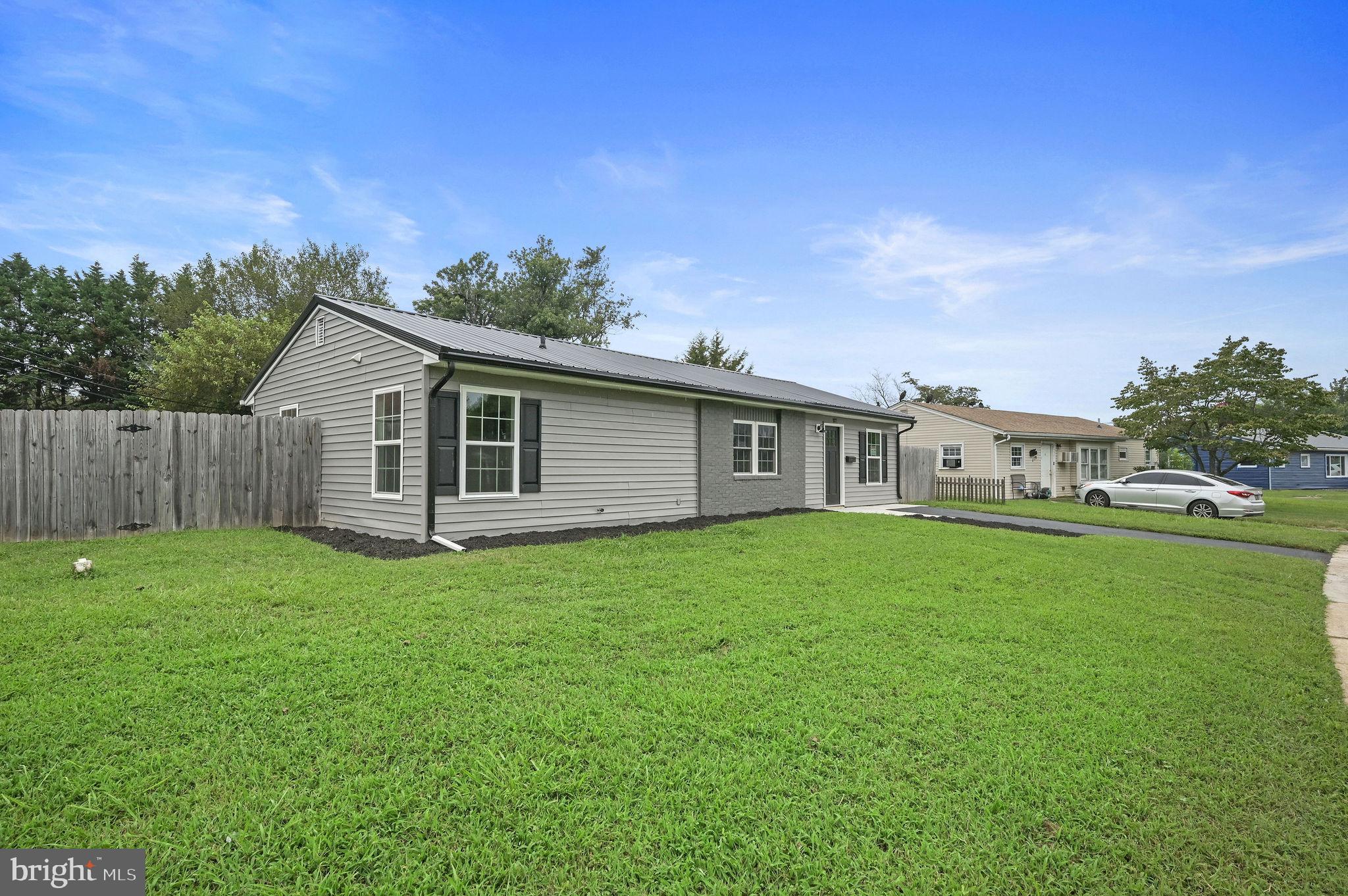 New metal roof with matching gutters & downspouts