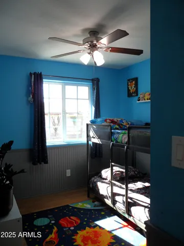 a livingroom with workspace and a window