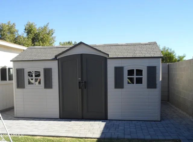 a backyard of a house with seating space