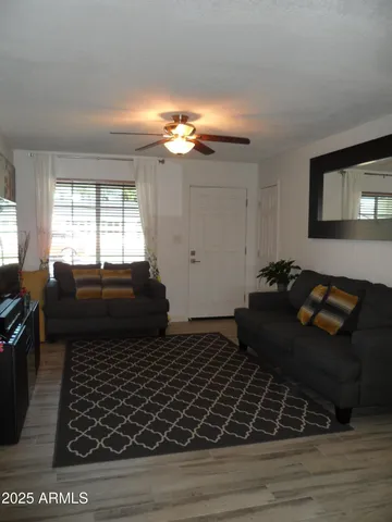 a kitchen with stainless steel appliances granite countertop a stove a sink and a granite counter tops with white cabinets