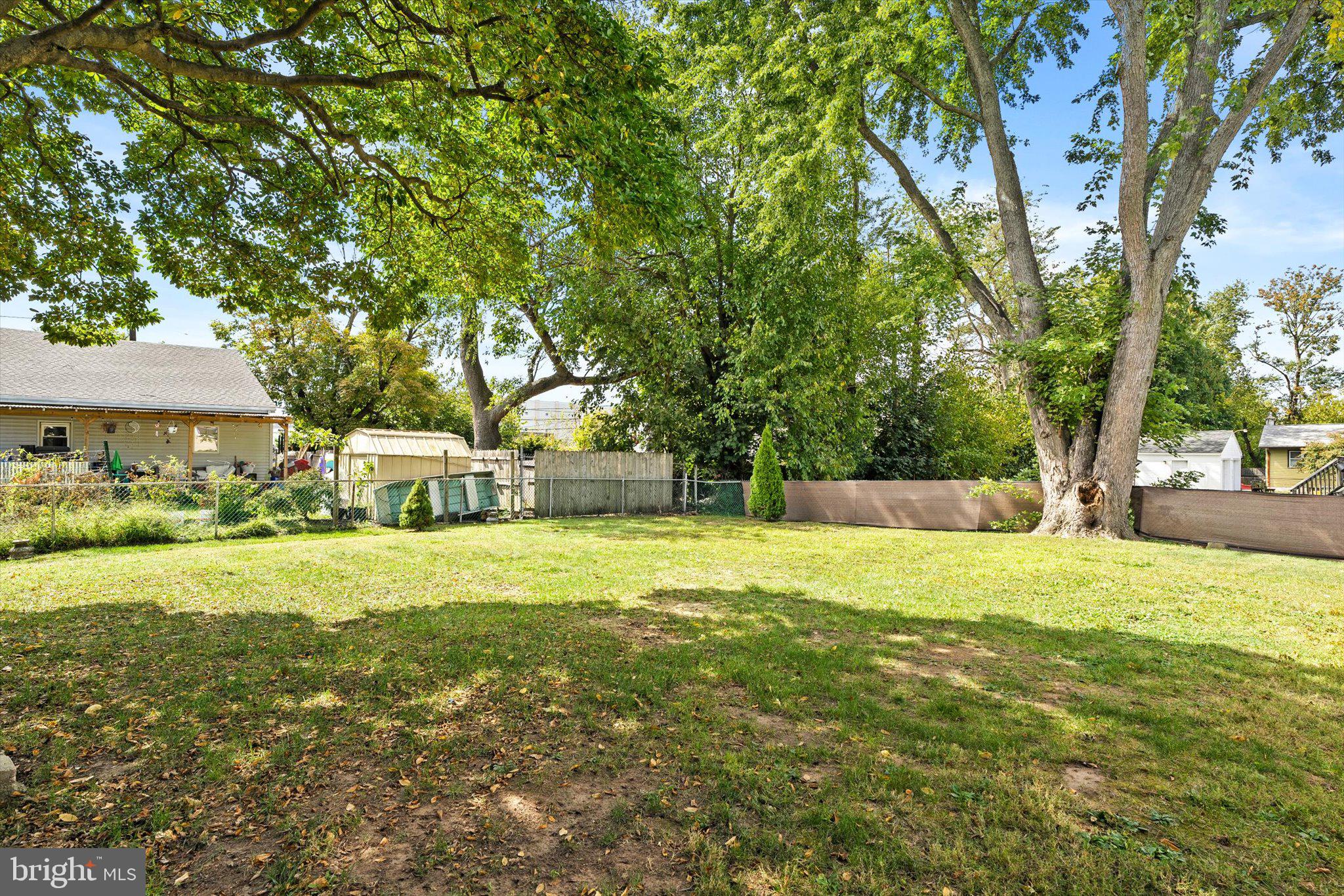 81 3rd Avenue Hamilton, NJ 08619 - Photo 24 of 26 a yellow house with trees in front of it