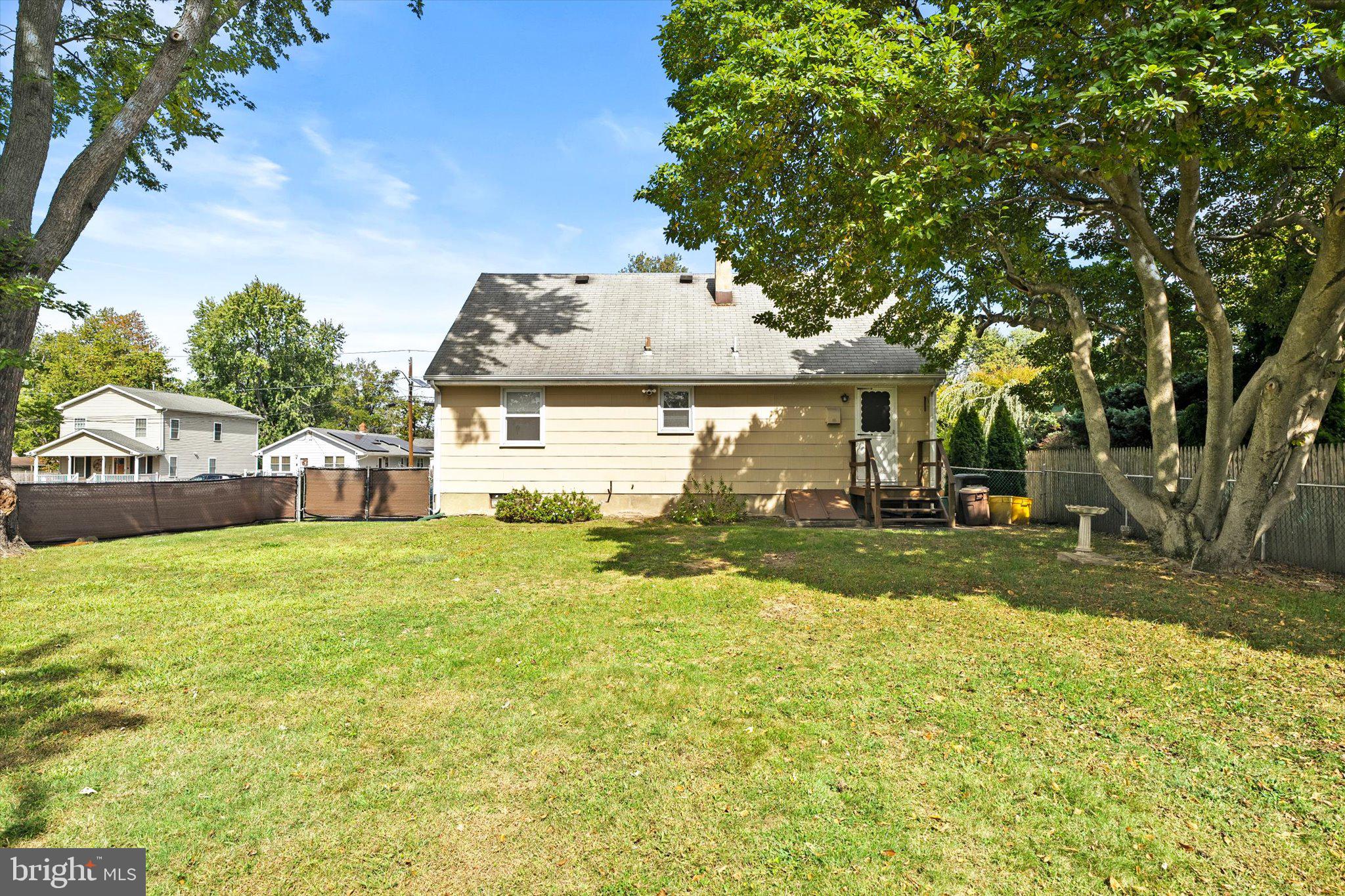81 3rd Avenue Hamilton, NJ 08619 - Photo 26 of 26 a front view of a house with a yard garage and outdoor seating