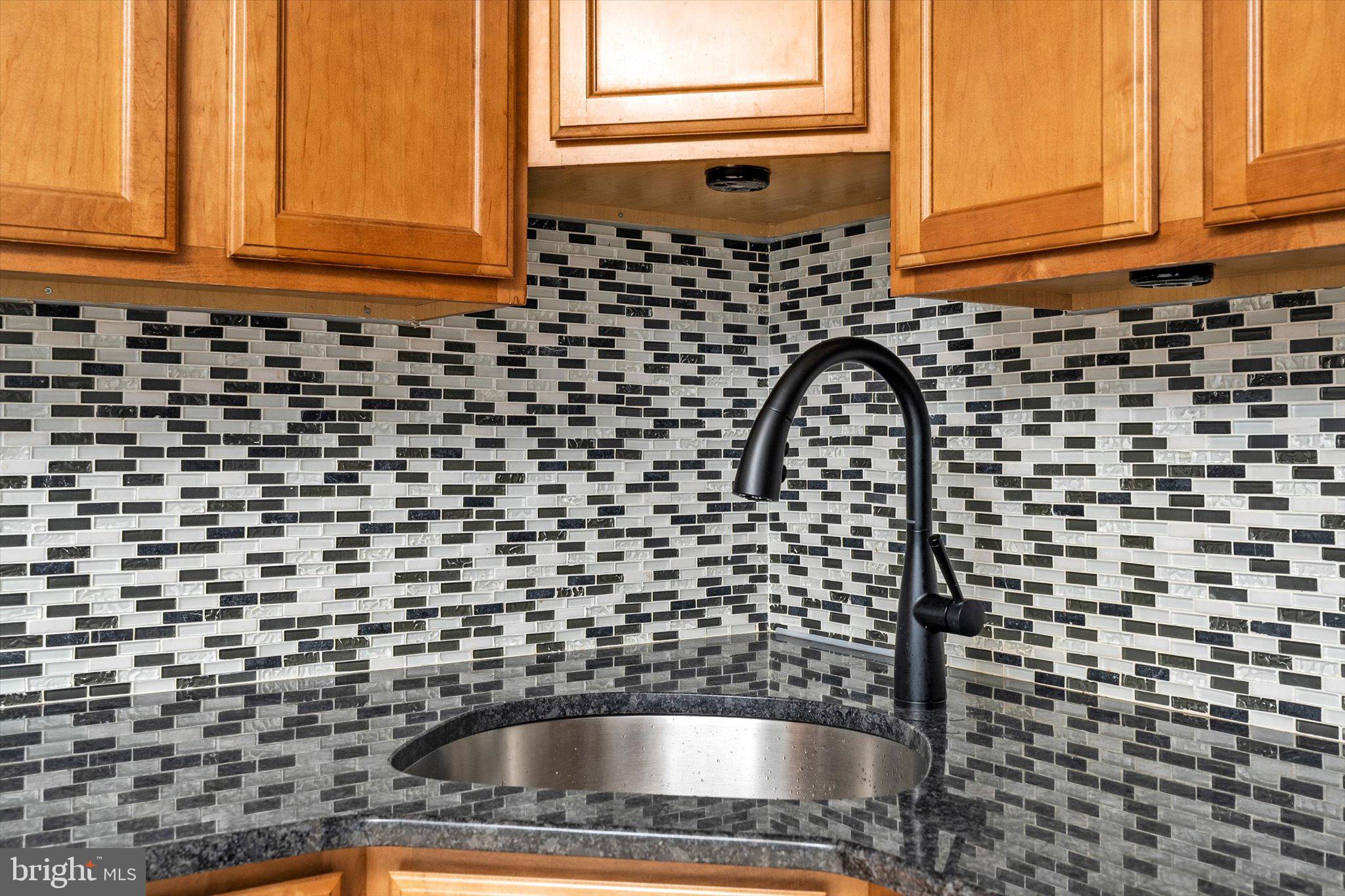 81 3rd Avenue Hamilton, NJ 08619 - Photo 9 of 26 a bathroom with a sink a mirror and a shower