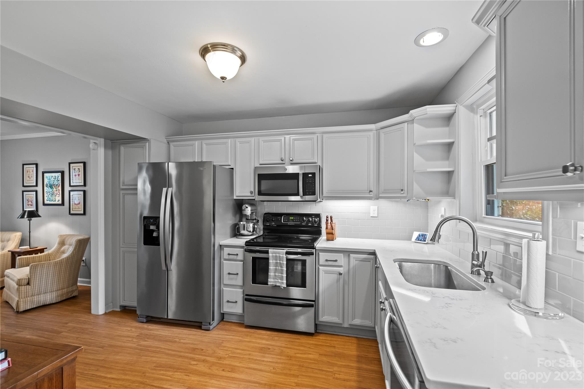 4014 Sulkirk Road Charlotte, NC 28210 - Photo 13 of 23 a kitchen with stainless steel appliances granite countertop a refrigerator stove and sink