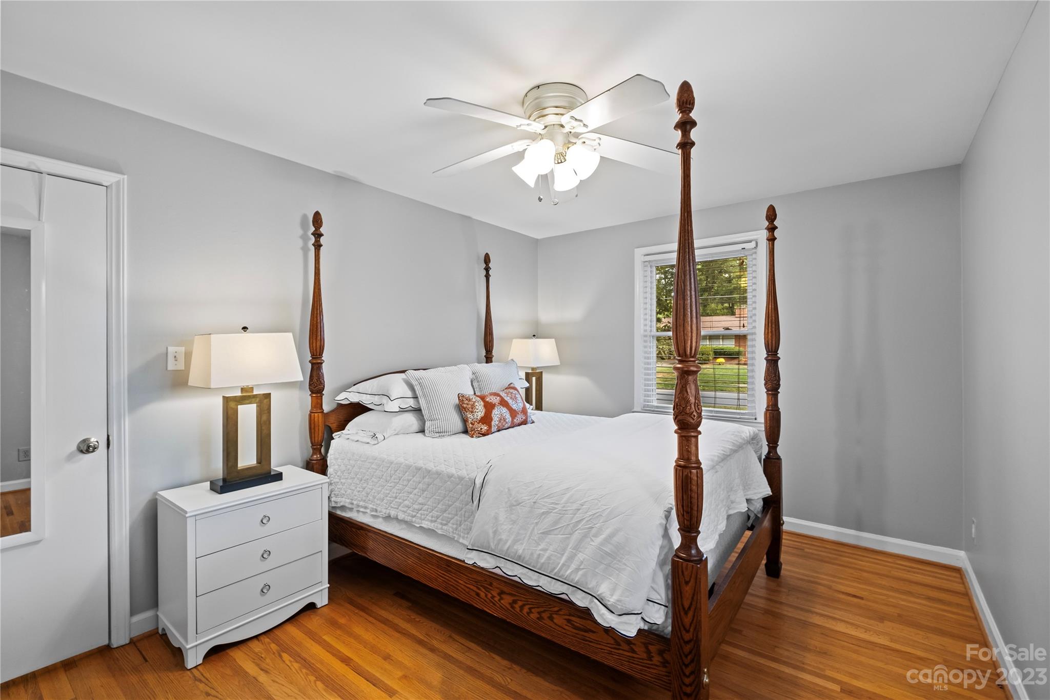 4014 Sulkirk Road Charlotte, NC 28210 - Photo 17 of 23 a bedroom with a bed and a chandelier