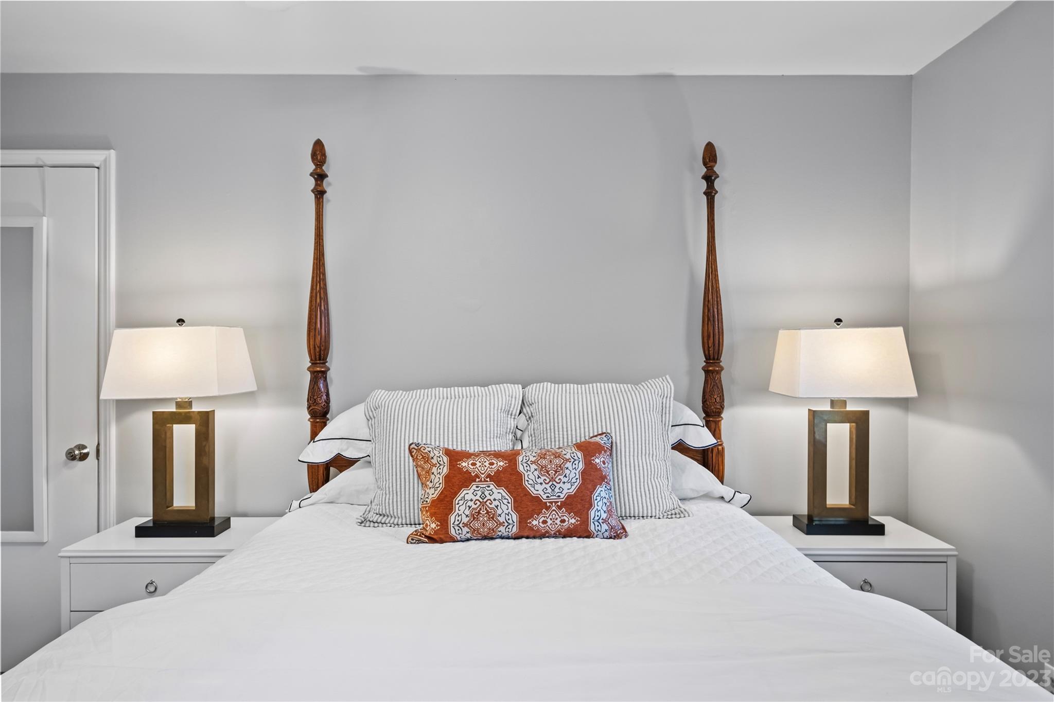 4014 Sulkirk Road Charlotte, NC 28210 - Photo 18 of 23 a bedroom with a bed and a lamp