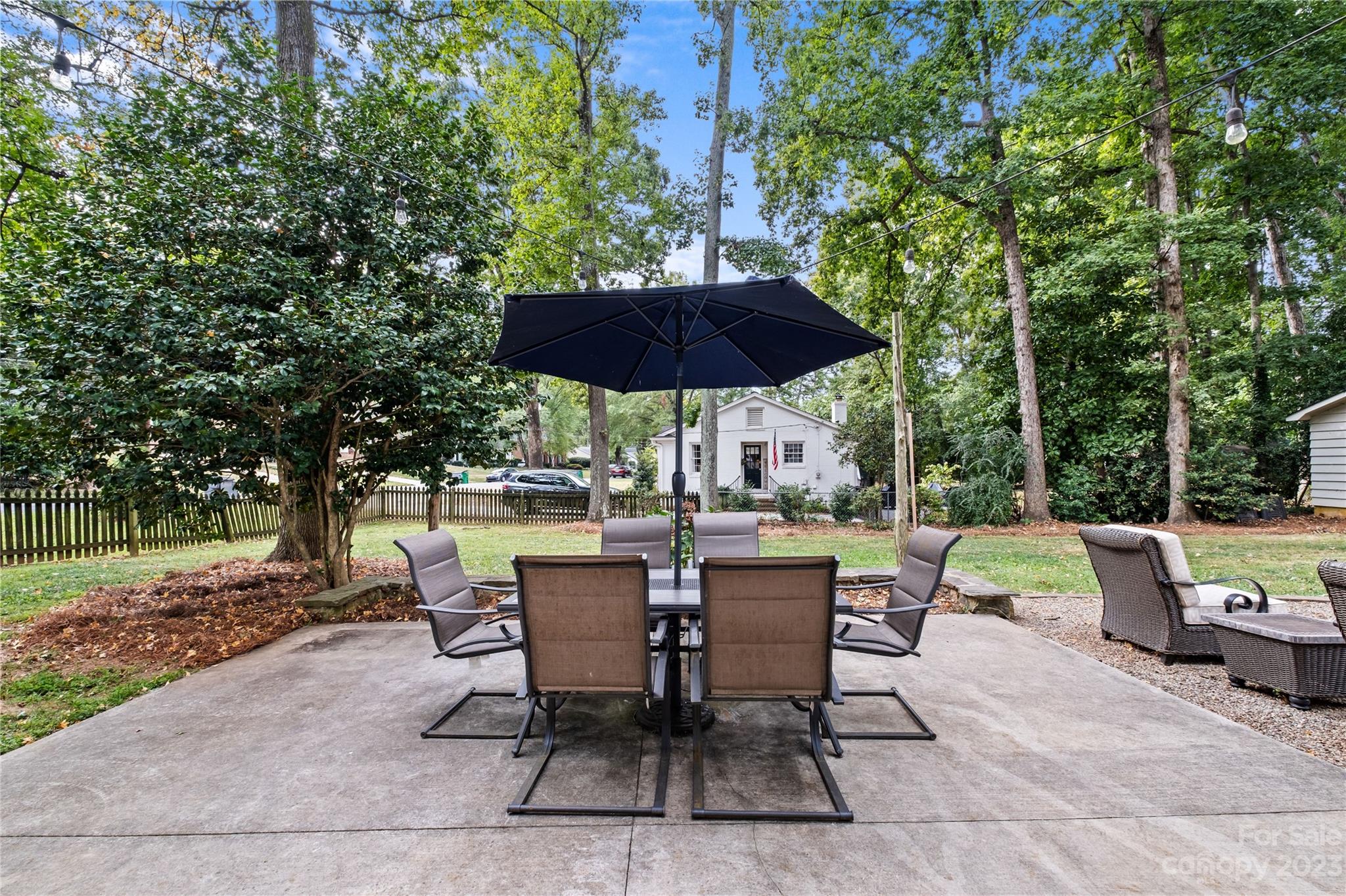 4014 Sulkirk Road Charlotte, NC 28210 - Photo 20 of 23 a view of backyard with seating space and trees