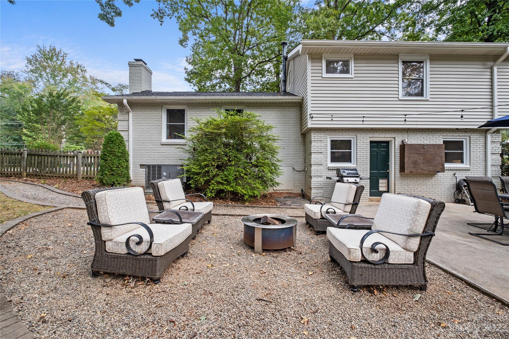 4014 Sulkirk Road Charlotte, NC 28210 - Photo 21 of 23 a view of a patio with couple of chairs and a fire pit