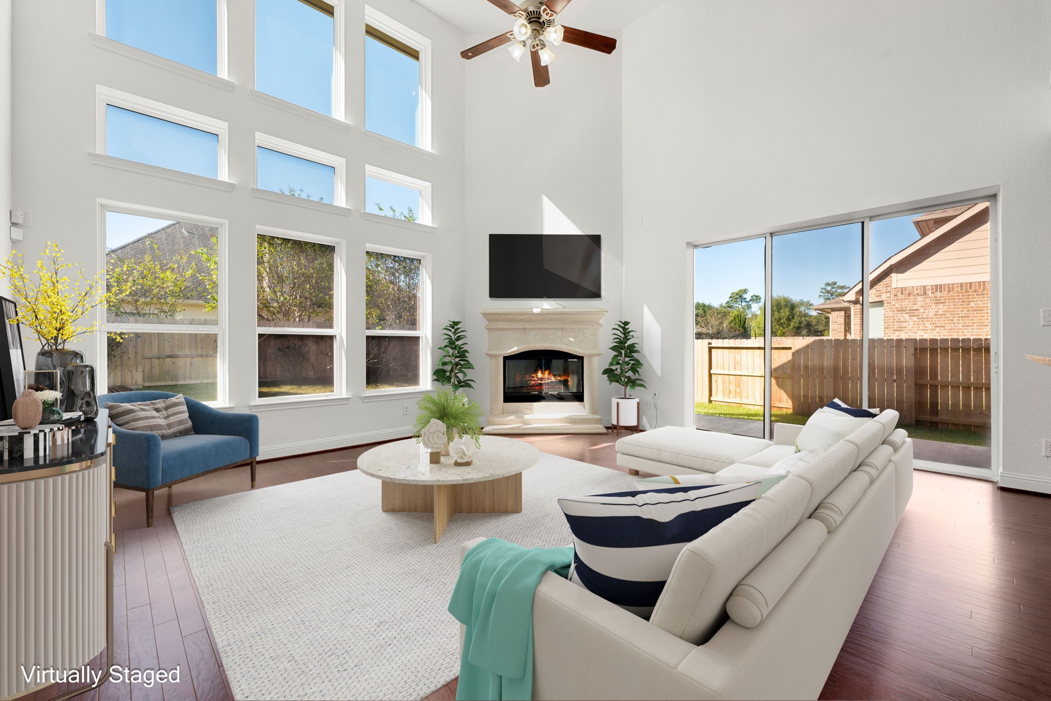 22719 Shieldhall Lane Tomball, TX 77375 - Photo 11 of 49 a living room with fireplace furniture and a flat screen tv