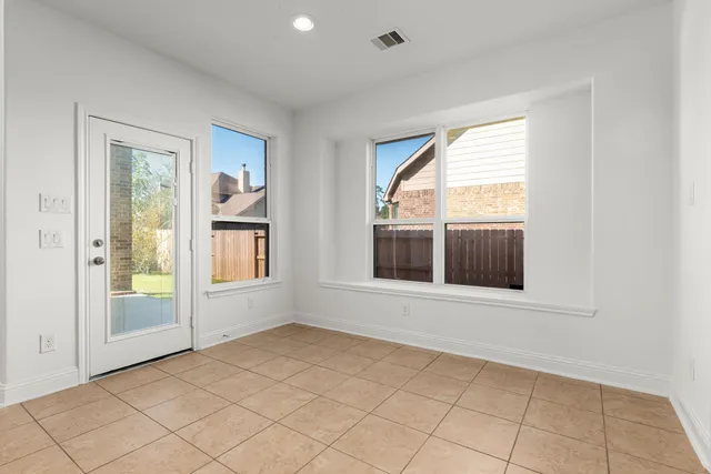 an empty room with windows