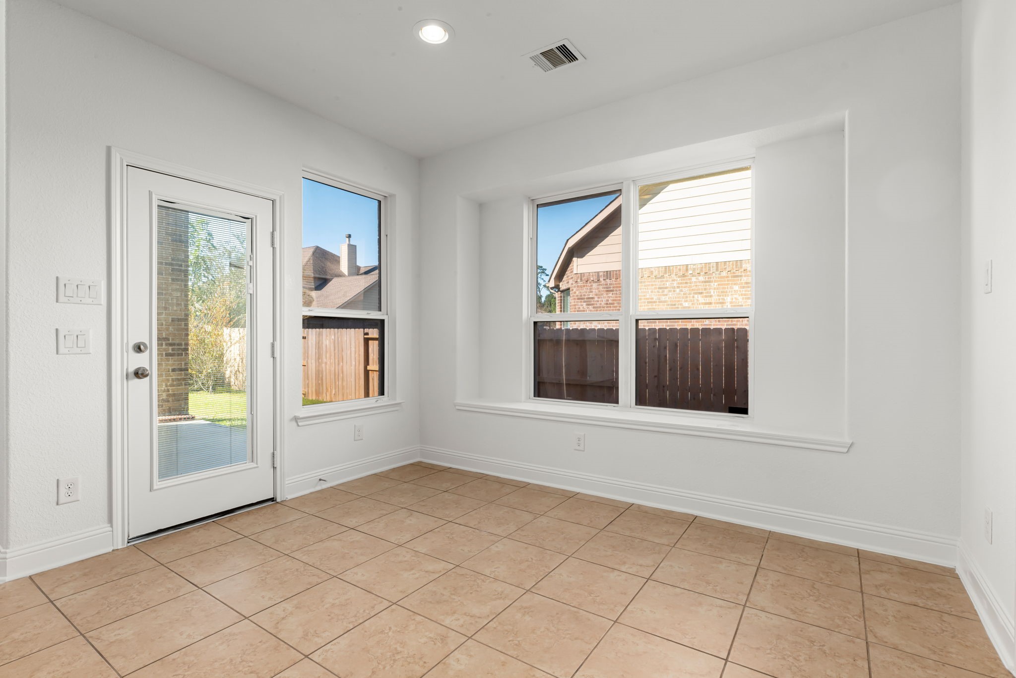 22719 Shieldhall Lane Tomball, TX 77375 - Photo 17 of 49 an empty room with windows