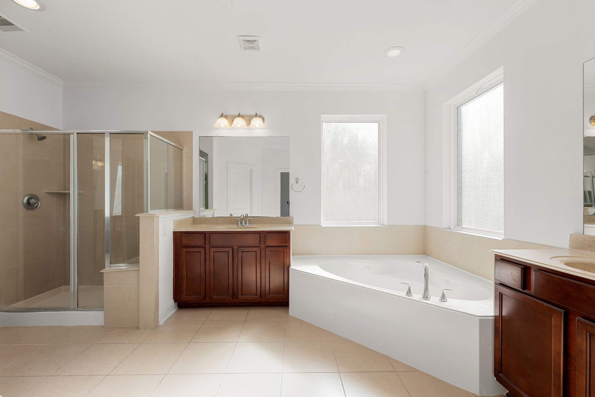 22719 Shieldhall Lane Tomball, TX 77375 - Photo 21 of 49 a spacious bathroom with a tub shower and sink