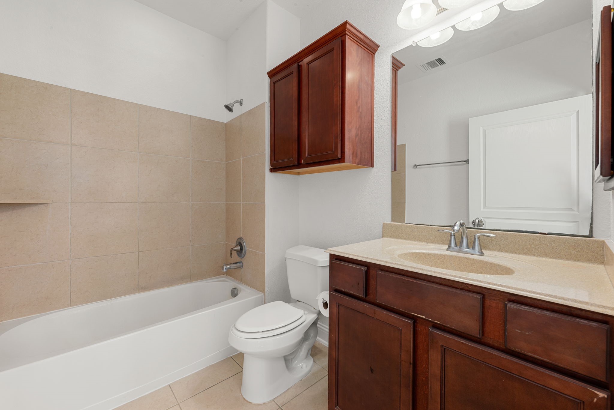 22719 Shieldhall Lane Tomball, TX 77375 - Photo 24 of 49 a bathroom with a sink a toilet and shower